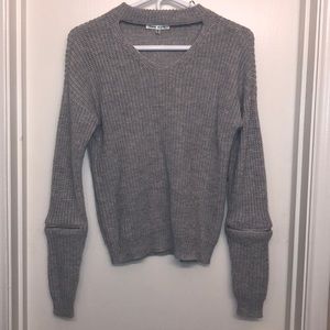 Warm sweater with zip off sleeves